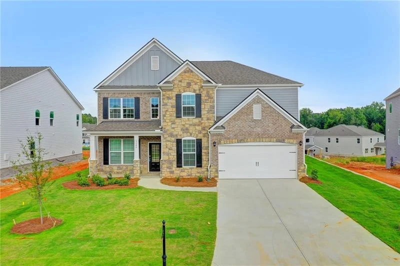 Front exterior of 5280 Blue Mountain Lane with brick facade and covered porch